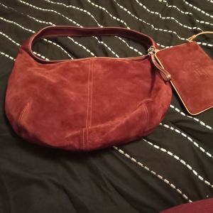 Coach cranberry purse with matching wallet.